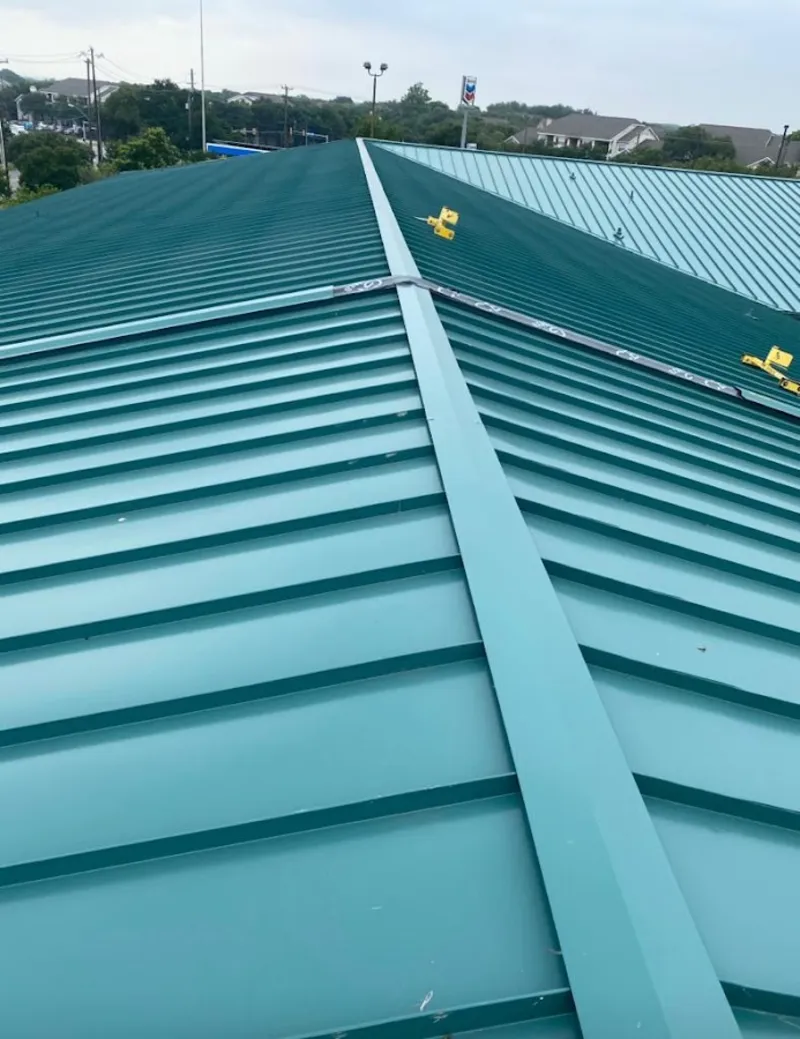 Green commercial metal roof ridge and valley for Metal Roof Repair in Baxter