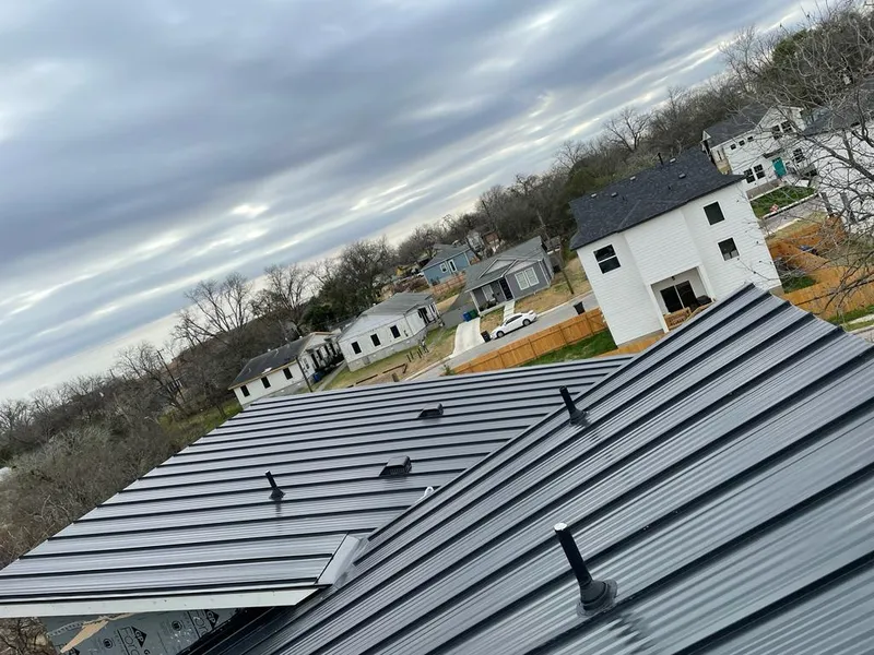 Standing seam metal roof panels with vents for Skylight Repair in Baxter